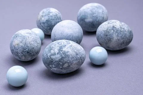 Close-up of Easter eggs of marble coloring on a gray background. Easter backg Stock Photos
