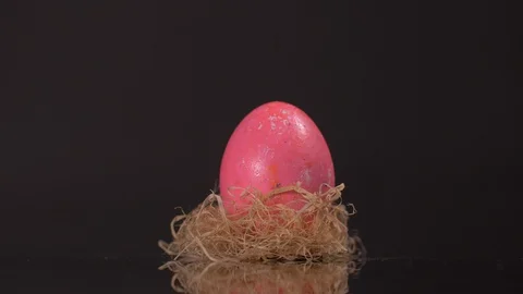 Close up of Easter Eggs Rotating on Black Background Video stock 129057036