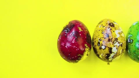 Close-up of Easter eggs on yellow bright background. Stock Footage 86763355