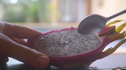 Close up of eating fresh dragon fruit for dessert. Slow motion. HD, 1920x1080 Stock-Footage 84815907