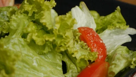 Close up eating fresh salad, fork take a slice of tomato. Healthy food Stock Footage 119014988