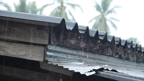Close up of the eaves with water drop in heavy rainy weather. Stock Footage 132892301