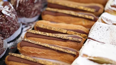 Close up of eclairs in counter of a bakery shop Stock Footage 167654009