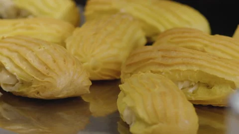 Close-up, Eclairs Lie on Metal Table at Restaurant Kitchen Stock Footage 136892483