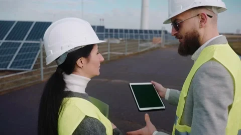 Close up of ecological engineers use digital tablet and talk at the powerhouse Stock-Footage 171969618