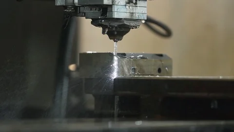 Close up EDM manufacturing process shapes metal by creating sparks Stock Footage 110981184