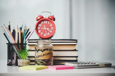 Close-up education object with stack money coin-cash dollar and glass jar on Foto stock