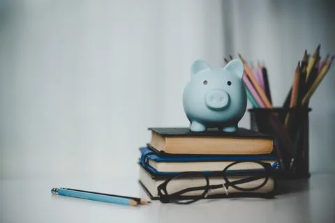 Close-up education object with stack money coin-cash dollar and glass jar on Stock Photos