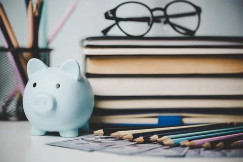 Close-up education object with stack money coin-cash dollar and glass jar on Stock Photos