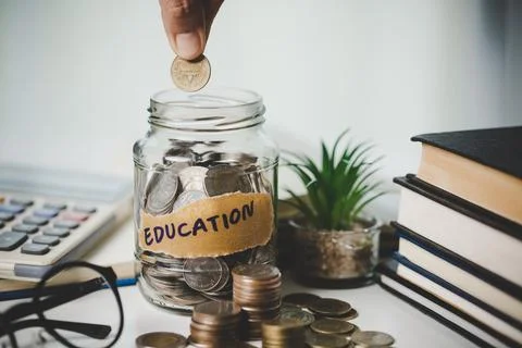 Close-up education object with stack money coin-cash dollar and glass jar o.. Stock Photos