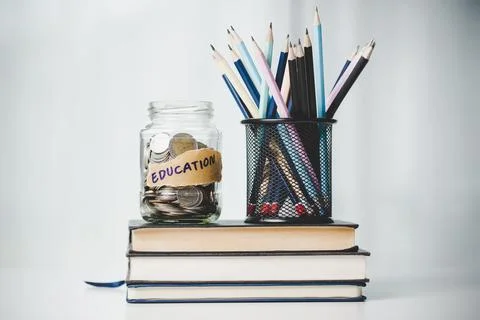 Close-up education object with stack money coin-cash dollar and glass jar o.. Stock Photos