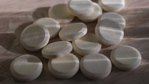 Close-up of effervescent tablets of pain reliever or vitamin supplement Stock Footage 326653178