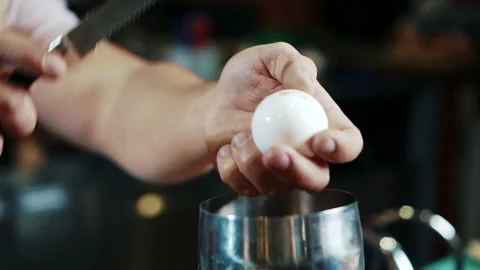 Close up of egg being broken in modern stylish bar. Stock Footage 88575970