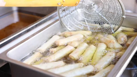 Close Up Of Egg Rolls Being Deep Fried Stockbeeldmateriaal 347660462