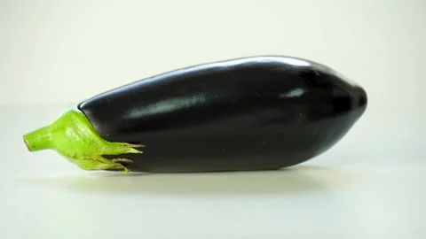 Close-Up Of  Eggplant Rotating On The White Background 스톡 동영상 236203016