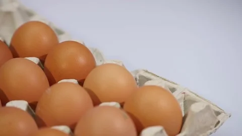 Close up of Eggs in a paper tray, egg carton isolated on a white background Stock Footage 76956253
