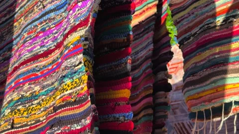 Close up of Egyptian hand made cotton striped carpets with colorful woven Stock Footage 340943963