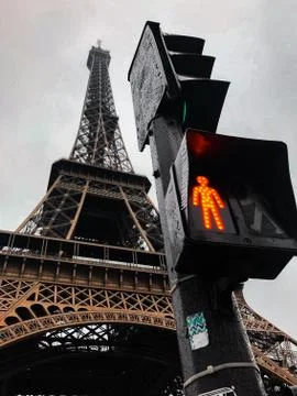 Close to the Eiffel tower after a pedestrian traffic light in red, symbol of  스톡 사진