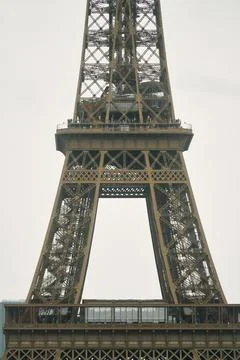 Close-up of Eiffel Tower lower midsection showing iron lattice observation deck Stock Photos