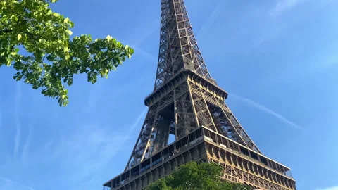 Close up of the Eiffel Tower  on a spring day with blue sky in Paris, France Stock Footage 197361821