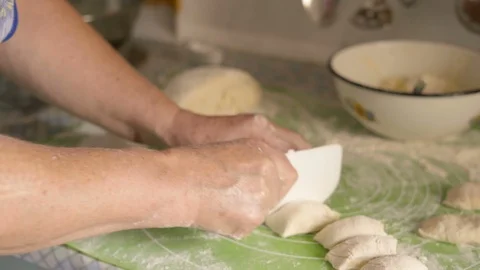 Close-up, Elder Woman's Hands Slice Plastic Knife Equal Pieces of Cake Test Stock Footage 93111467