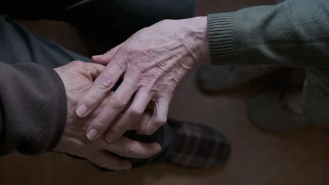 Close-Up of Elderly Hands Holding in Comforting and Supportive Gesture Stock Footage 307742401
