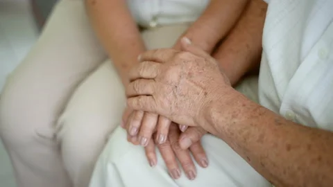 Close up of elderly hands holding each other Stock Footage 137047835