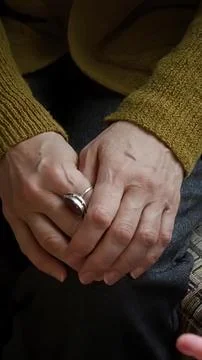 Close-up of elderly hands holding each other in love Stock Photos