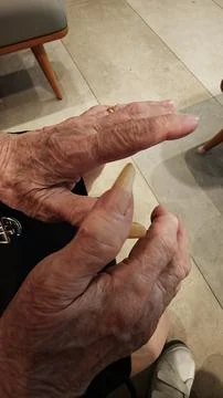Close-Up of Elderly Hands with Long Natural Fingernails–Aging &amp; Senior Care Stock Photos