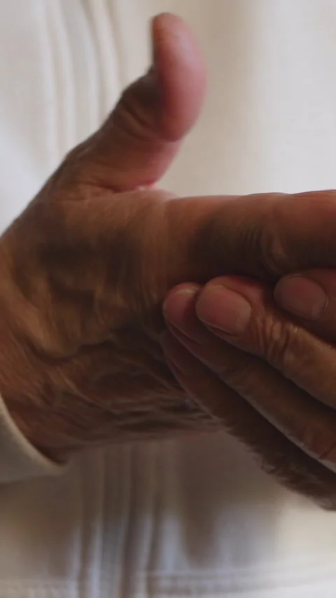 Close-Up Of Elderly Hands Rubbing Fingers Together Stock-Footage 304418430