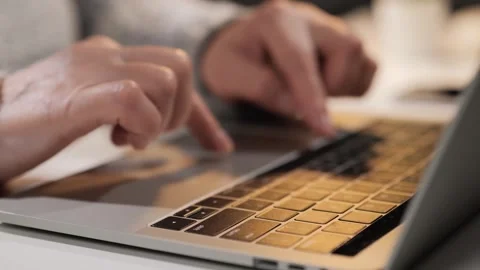 Close-up of elderly hands typing on laptop Vidéo 273293443