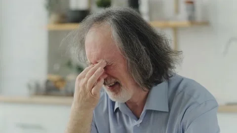 Close up of elderly man feeling tired while touching his eyes with fingers Stock Footage 239837396