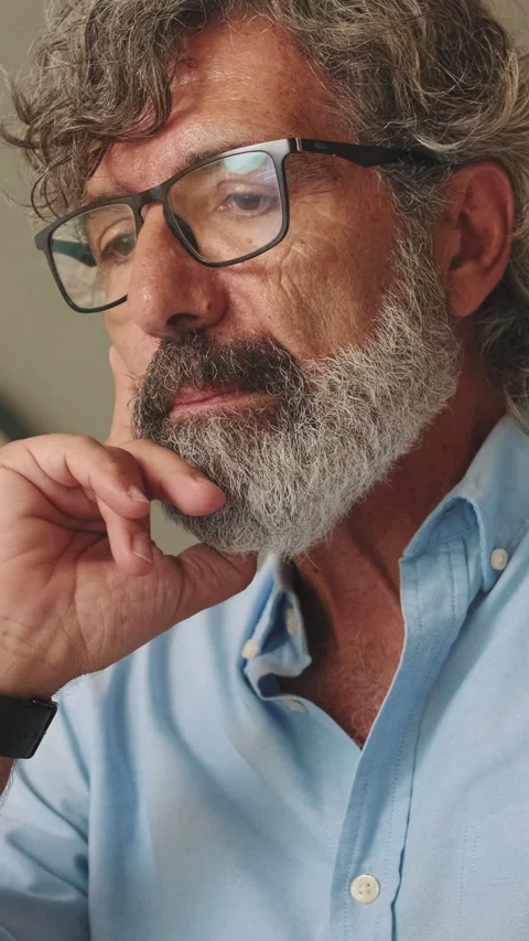 Close up, elderly man with glasses in living-room using laptop computer Stock Footage 254913295