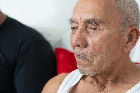 Close up of elderly man looking forward showing vision impairment and aging.. Фото