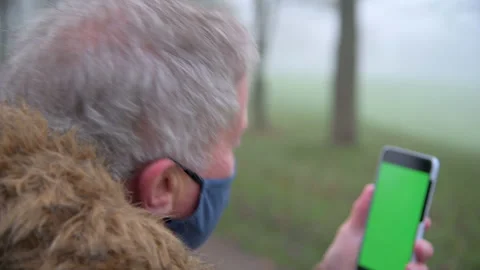 Close Up Elderly Man Video Call in Park Stock Footage 150957370