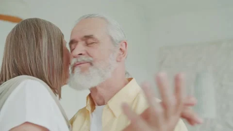 Close up elderly old couple dancing in the living room, the loving husband holds Vídeos de archivo 224537433