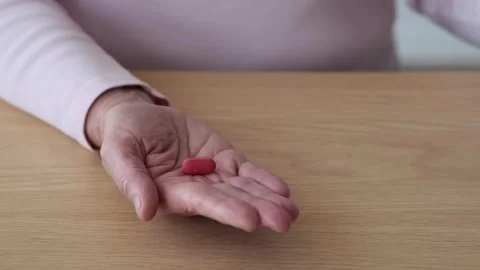 https://images.pond5.com/close-elderly-woman-hand-pills-footage-254435388_iconl.jpeg