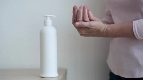 Close Up of Elderly Woman Hands Applying Cream Stock-Footage 254440657
