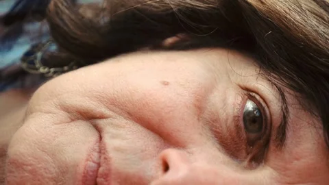 Close-up of elderly woman's half face Video stock 278369826