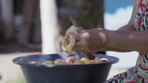 Close-Up of an Elderly Woman's Hand With a Knife Peeled Apple Stock Footage 96043283
