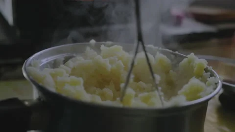 Close-up, Elderly Woman's Hand Tolch Freshly Cooked Potato Puree in Metal Bar Stock Footage 150113996