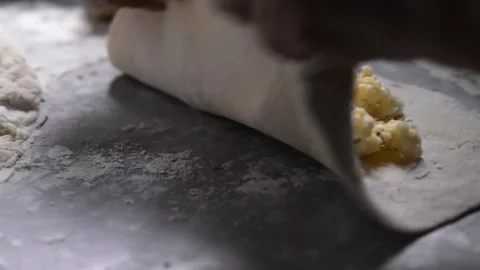 Close-up of an elderly woman's hands preparing cheese-filled panzerotto in .. Stock-Footage 291367852