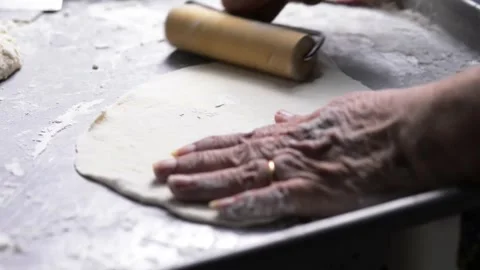 Close-up of an elderly woman's hands preparing cheese-filled panzerotto in .. 動画素材 291367888