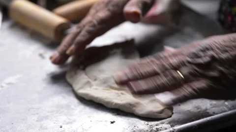 Close-up of an elderly woman's hands preparing cheese-filled panzerotto in .. 動画素材 291367900