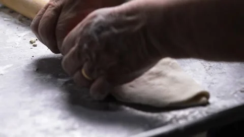 Close-up of an elderly woman's hands preparing cheese-filled panzerotto in .. 動画素材 291367905