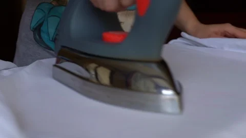 Close-up of electric device for ironing clothes. Housework appliance concept Stock Footage 121257767