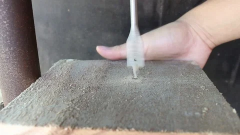 Close-up on electric drill machine drilling a hole in wood. Stock Footage 102605880