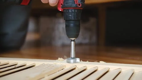 Close-up of electric drill making hole in wooden board Stock Footage 337298051
