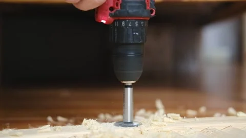 Close-up of electric drill making hole in wooden board Stock Footage 337298170