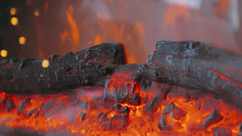 Close-up electric fireplace. Flames and coals from a working electric fireplace. Stock Footage 145238293